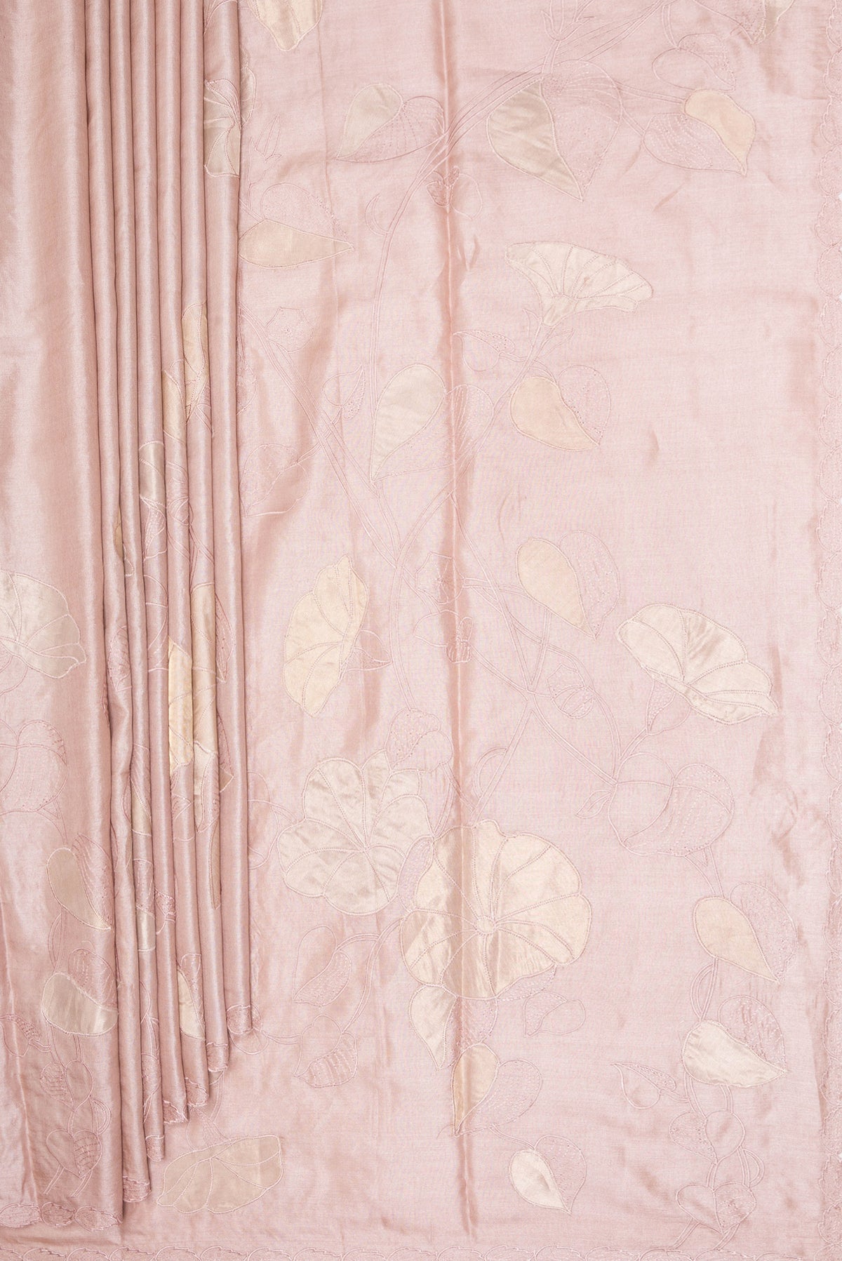 Pleats and pallu of Rose Gold Tussar Saree with Embroidery on the body and Embroidery Border. 