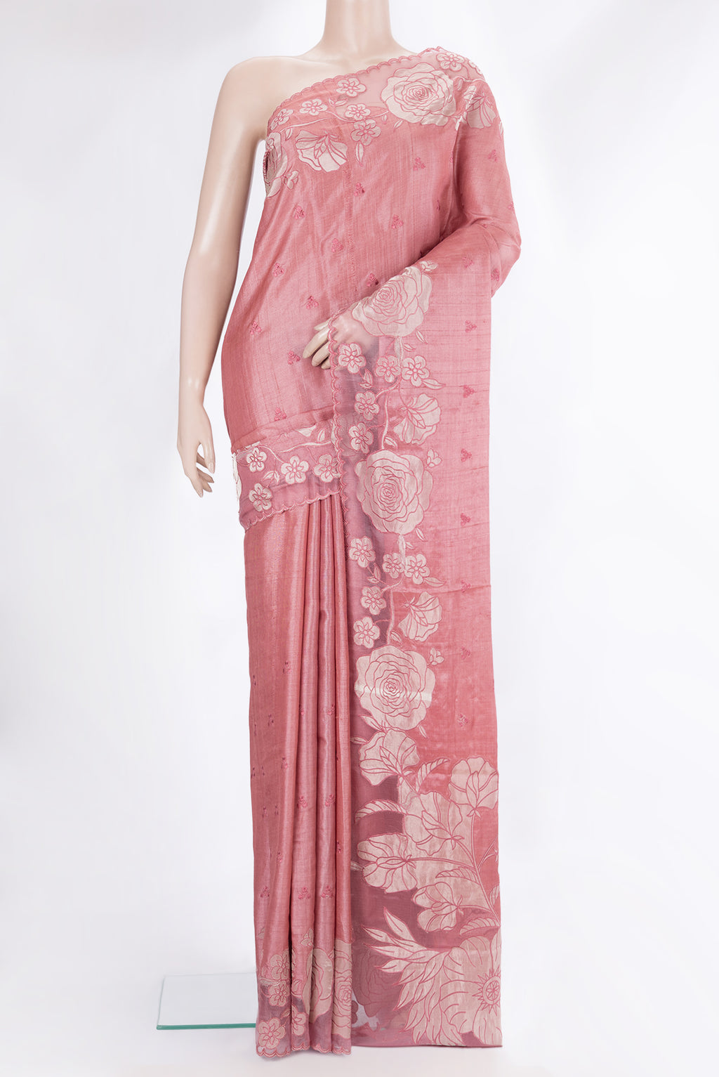Peach Tussar Saree with Embroidery on the body and Embroidery Border.  displayed on a mannequin