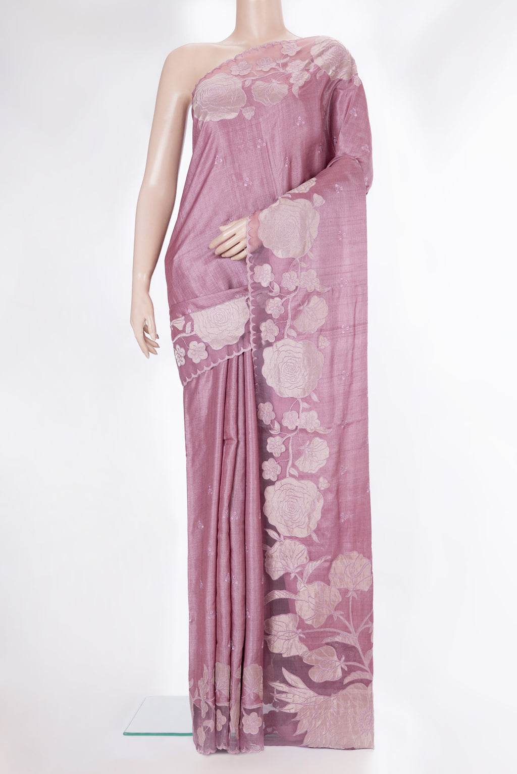 Rose Gold Tussar Saree with Embroidery on the body and Embroidery Border.  displayed on a mannequin
