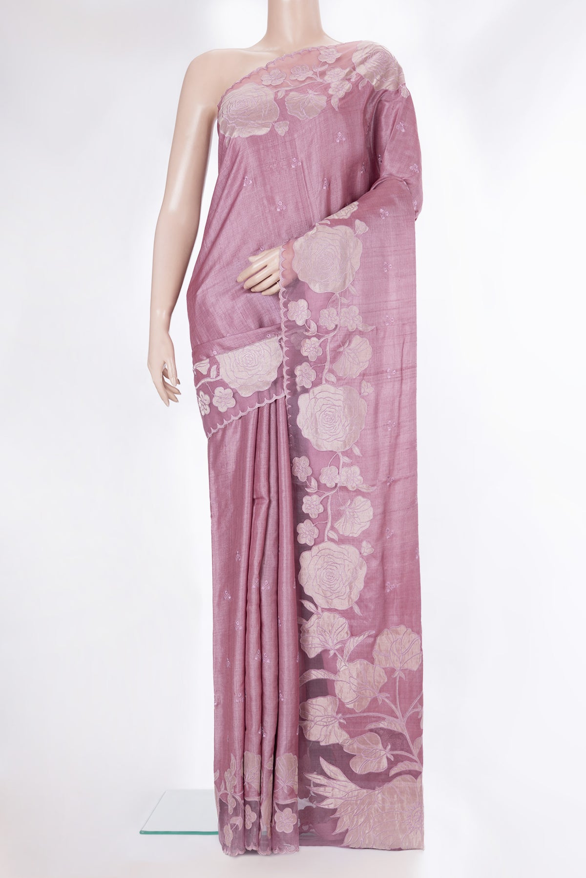 Rose Gold Tussar Saree with Embroidery on the body and Embroidery Border.  displayed on a mannequin