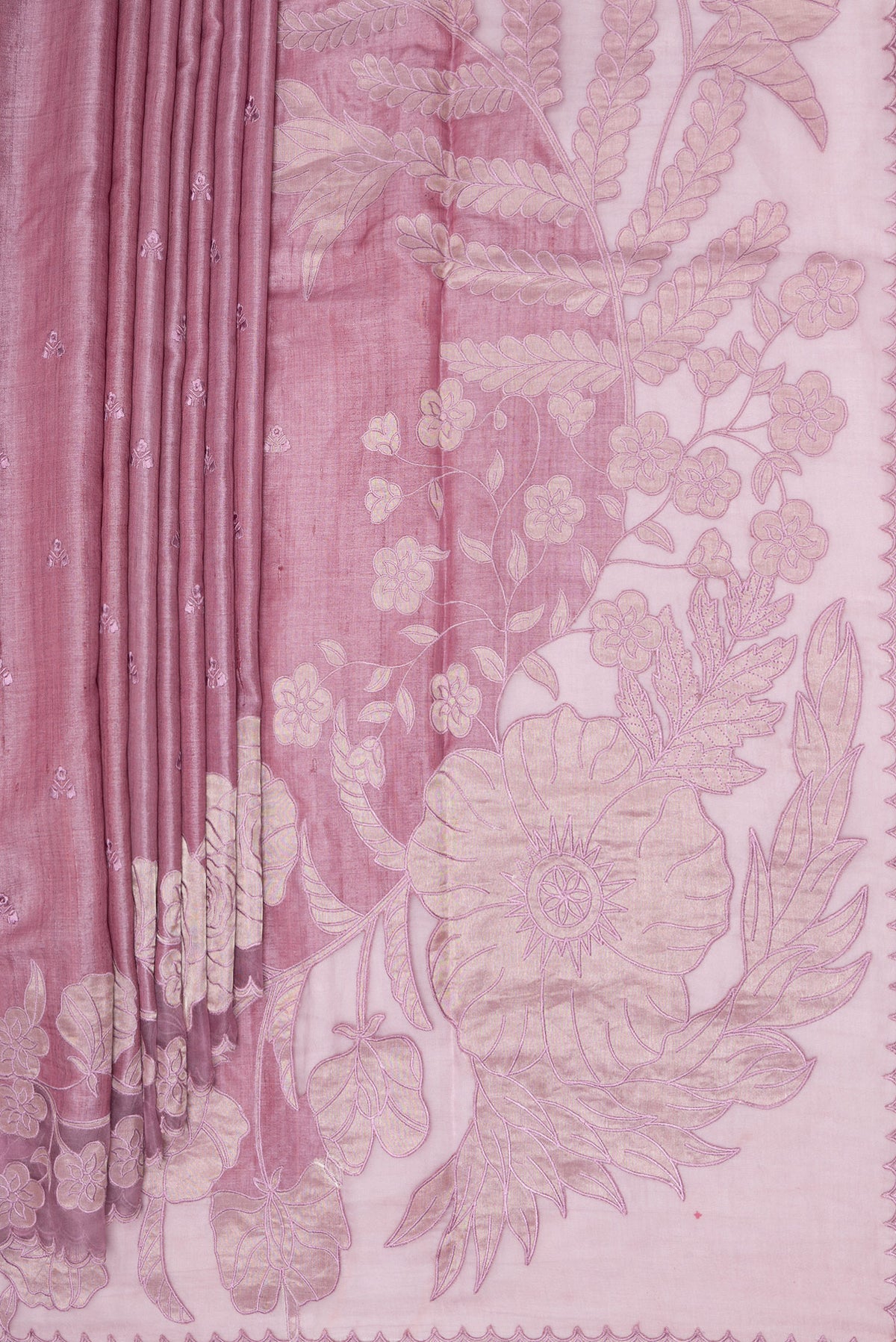 Pleats and pallu of Rose Gold Tussar Saree with Embroidery on the body and Embroidery Border. 