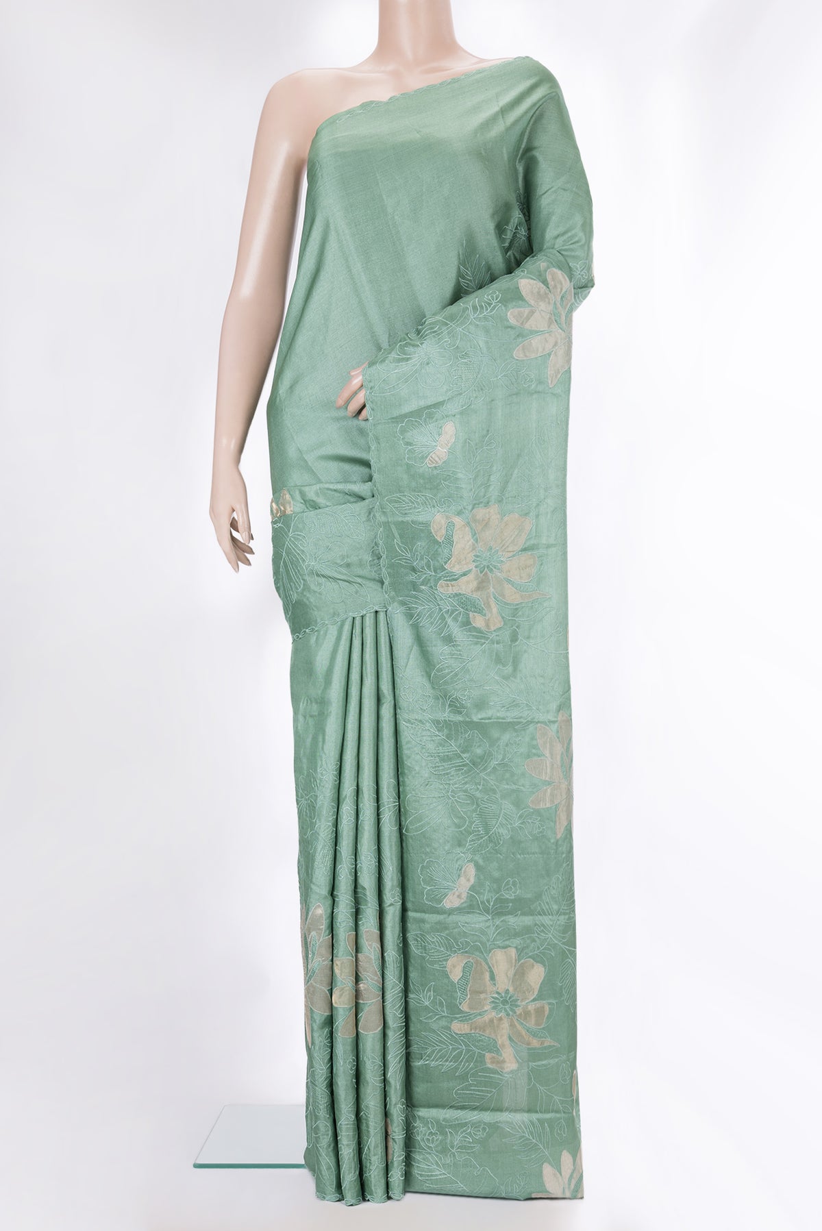 Pure Silk Mint Green Tussar Saree with Embroidery on the body and Embroidery Border.  displayed on a mannequin