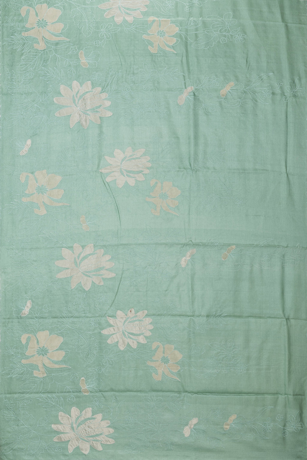 Flat view of Pure Silk Mint Green Tussar Saree with Embroidery on the body and Embroidery Border. 