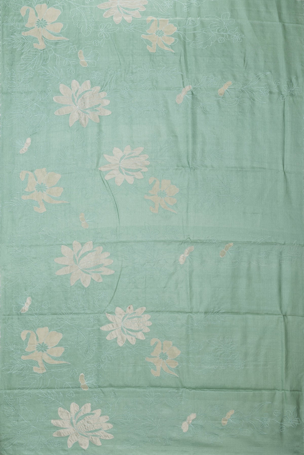 Flat view of Pure Silk Mint Green Tussar Saree with Embroidery on the body and Embroidery Border. 