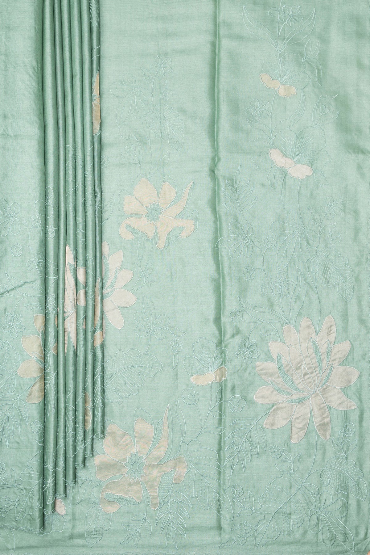 Pleats and pallu of Pure Silk Mint Green Tussar Saree with Embroidery on the body and Embroidery Border. 