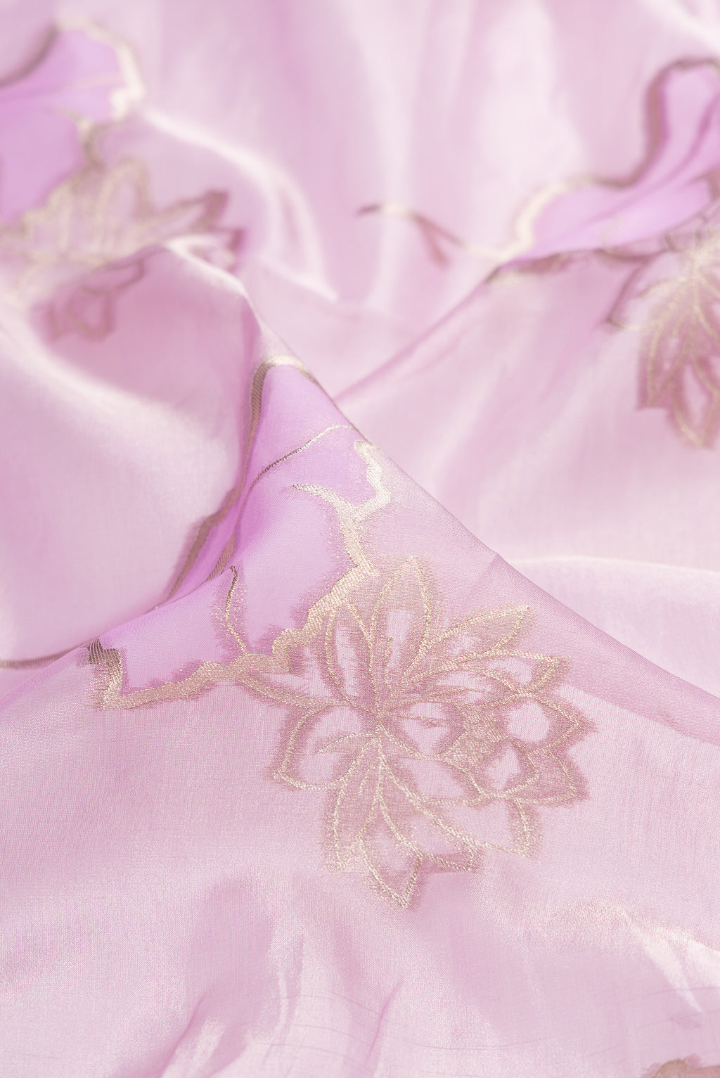 Close up of Lavender Dual Tone Banarasi Kora Saree with Zari Brocade on the body and Zari Border.  displaying folds