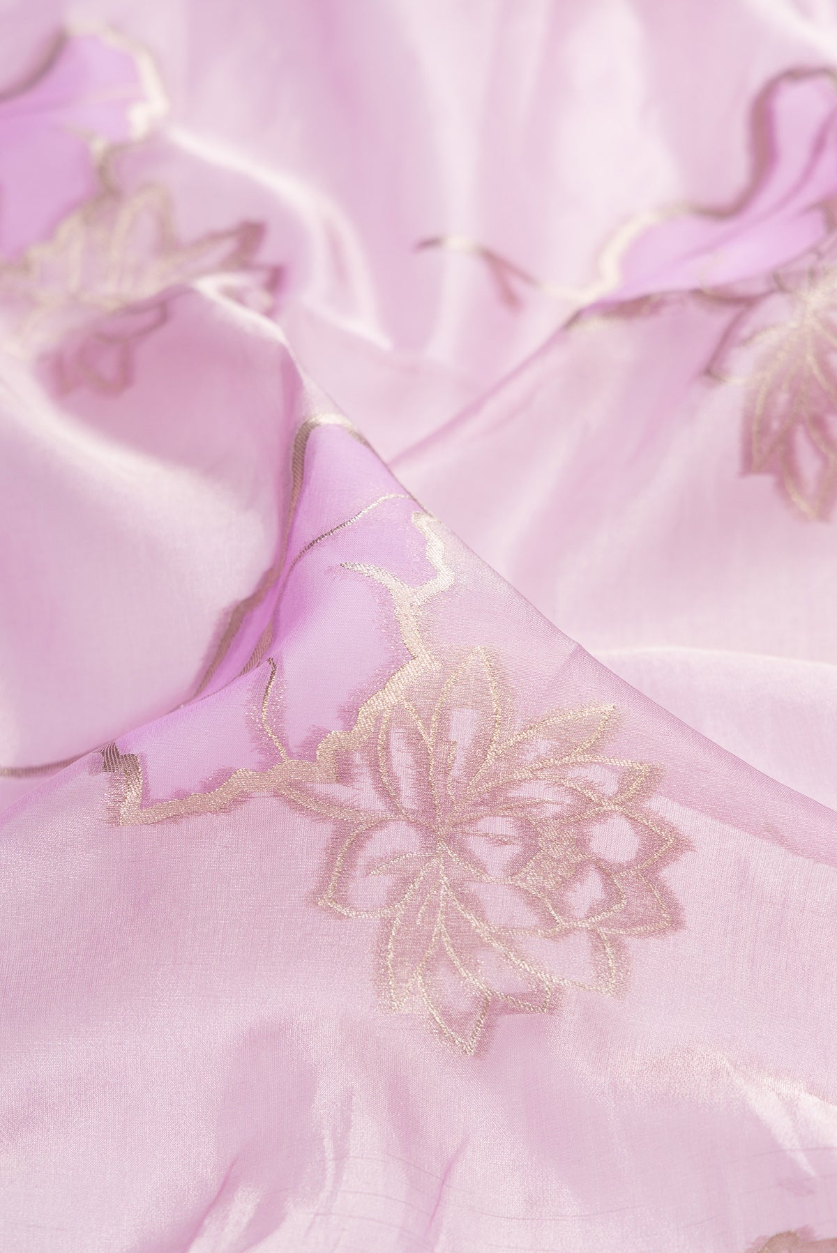 Close up of Lavender Dual Tone Banarasi Kora Saree with Zari Brocade on the body and Zari Border.  displaying folds