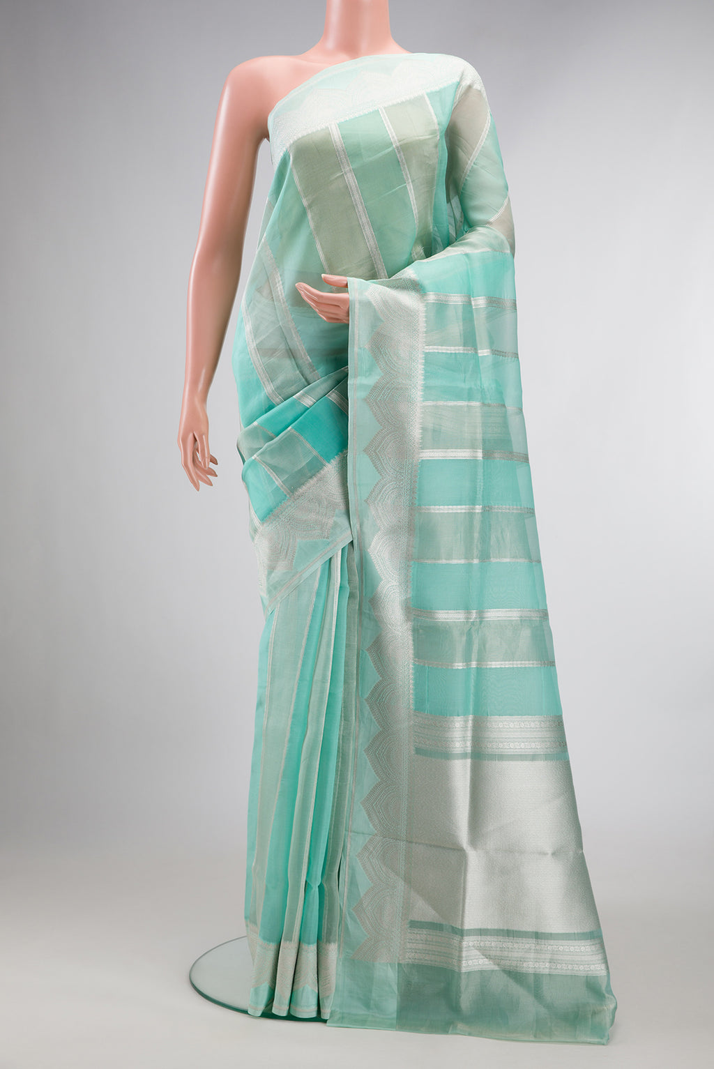 Turquoise Dual Tone Banarasi Kora Saree with Stripes on the body and Zari Border.  displayed on a mannequin
