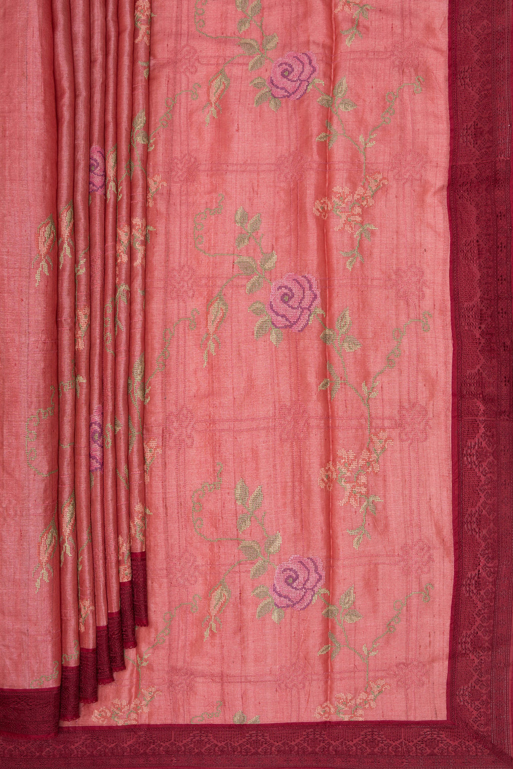 Pleats and pallu of Coral Tussar Saree with Embroidery on the body and Embroidery Border. 