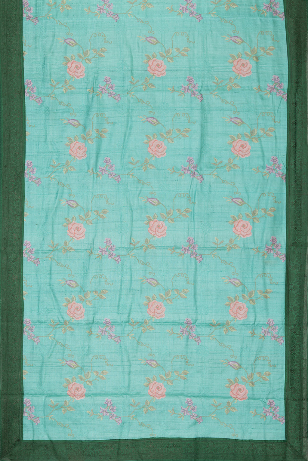 Flat view of Sea Green Tussar Saree with Embroidery on the body and Embroidery Border. 