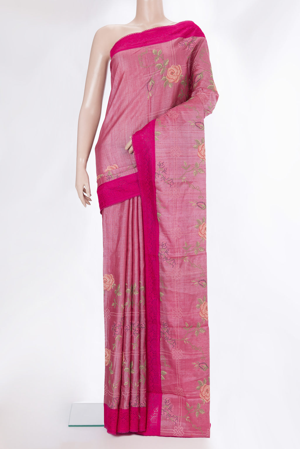 Pink Tussar Saree with Embroidery on the body and Embroidery Border.  displayed on a mannequin