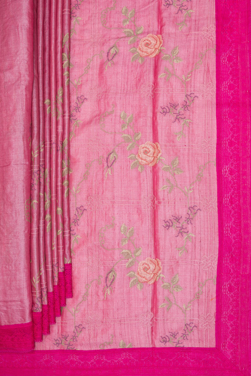 Pleats and pallu of Pink Tussar Saree with Embroidery on the body and Embroidery Border. 