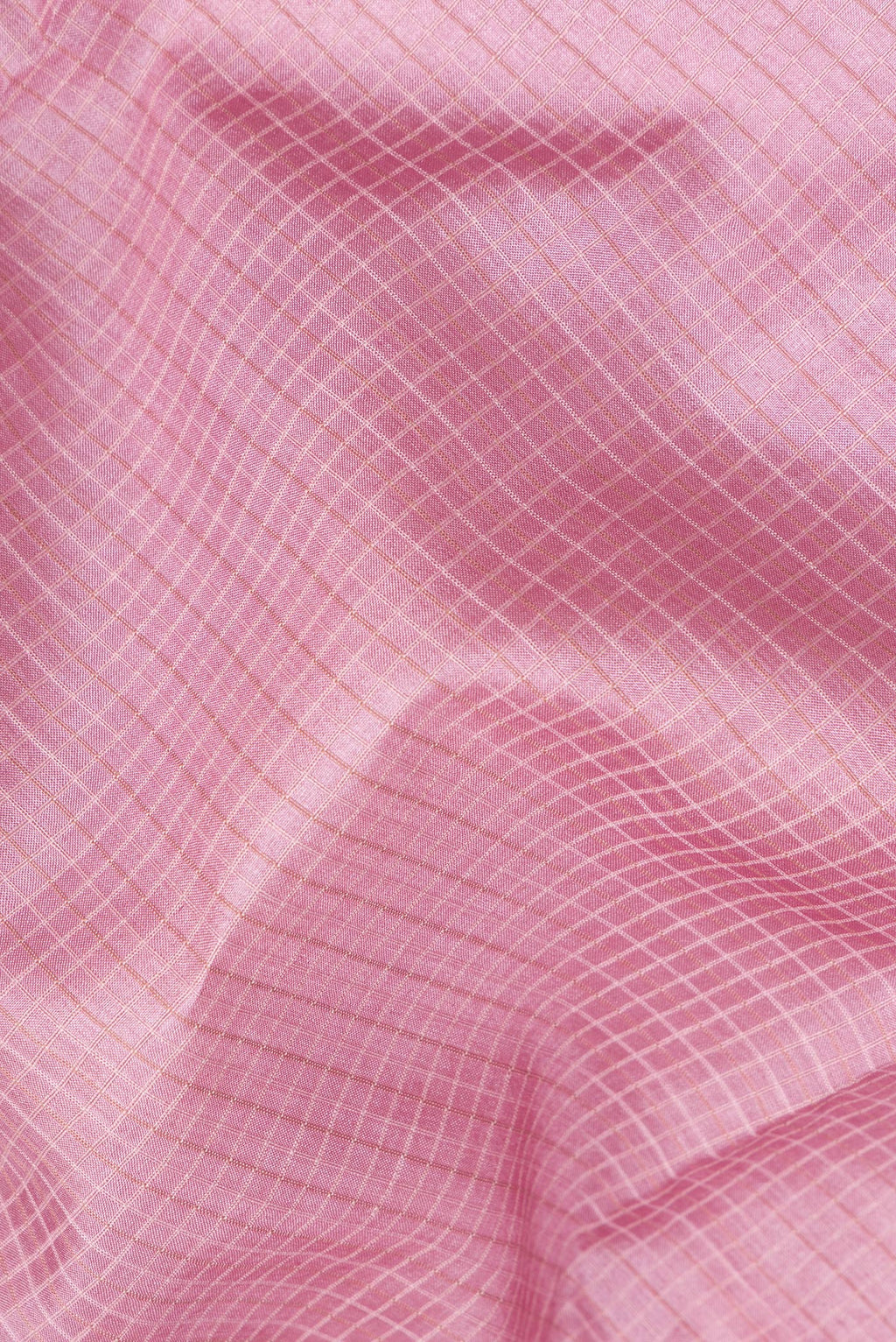 Close up of Pink Dual Tone Tussar Saree with Checked design on the body and Embroidery Border.  displaying folds