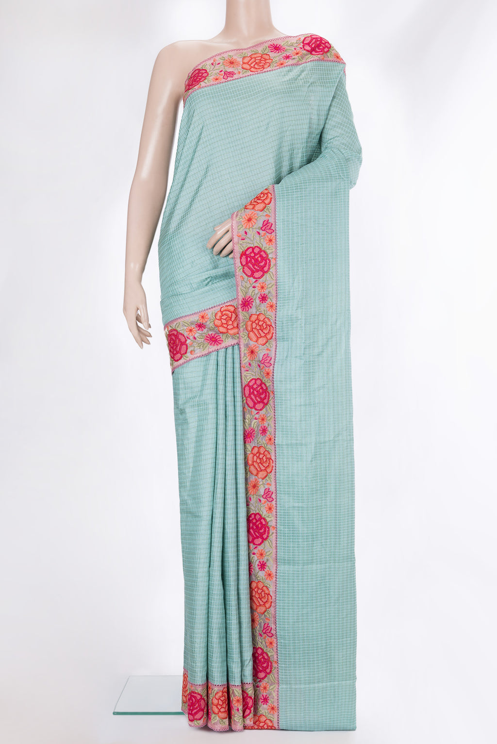 Sky Blue Tussar Saree with Checked design on the body and Embroidery Border.  displayed on a mannequin