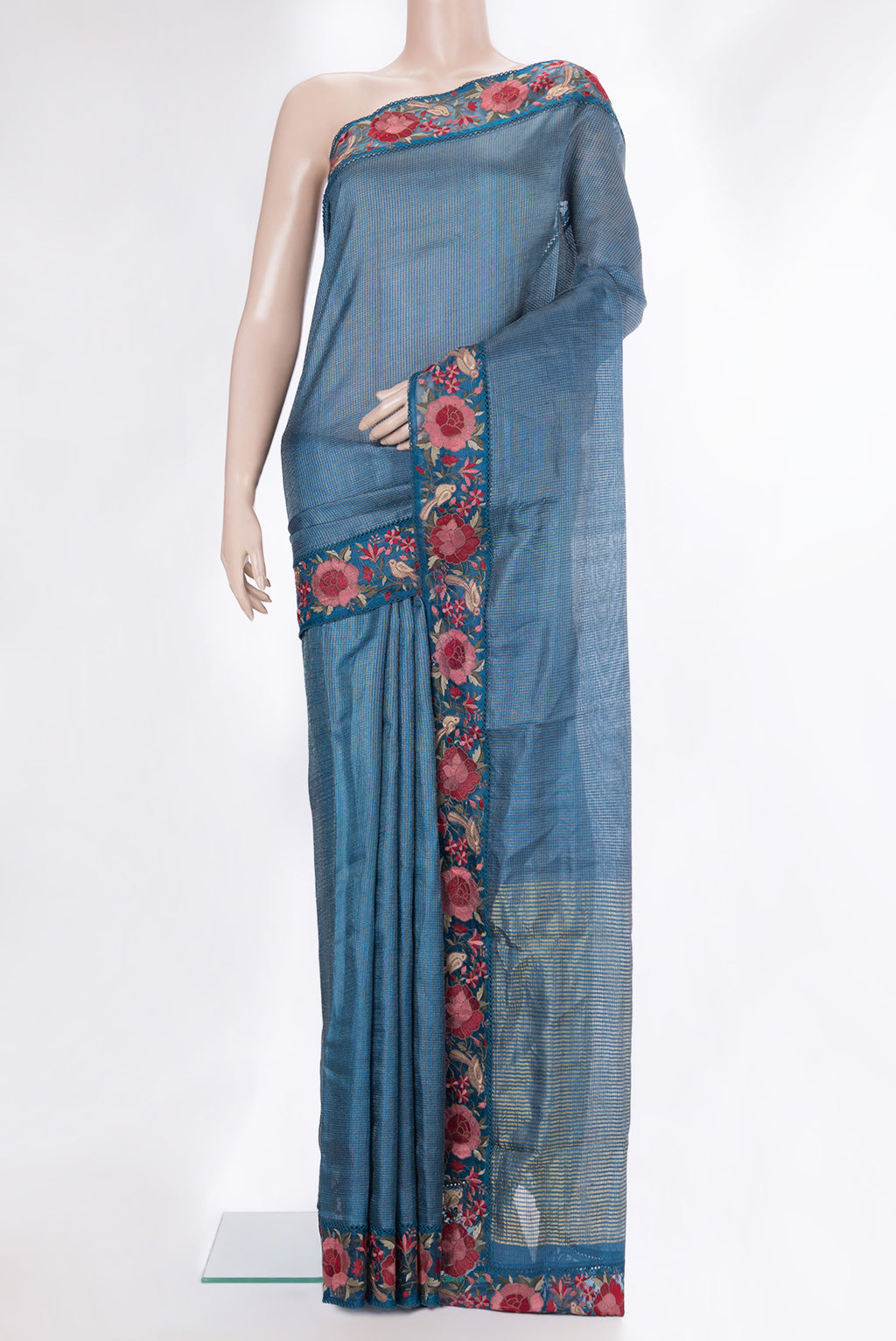 Peacock Blue Tussar Saree with Checked design on the body and Embroidery Border.  displayed on a mannequin