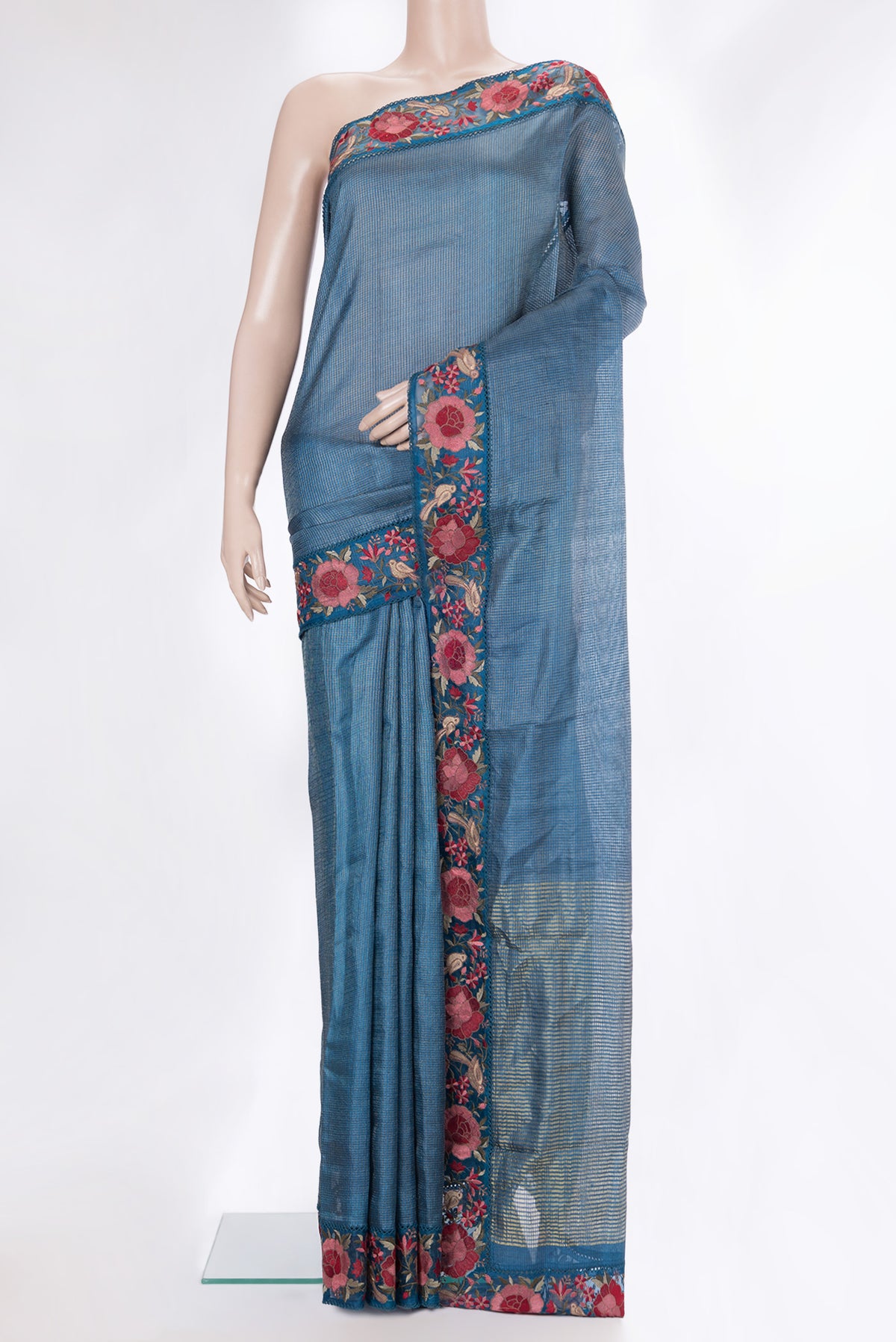 Peacock Blue Tussar Saree with Checked design on the body and Embroidery Border.  displayed on a mannequin
