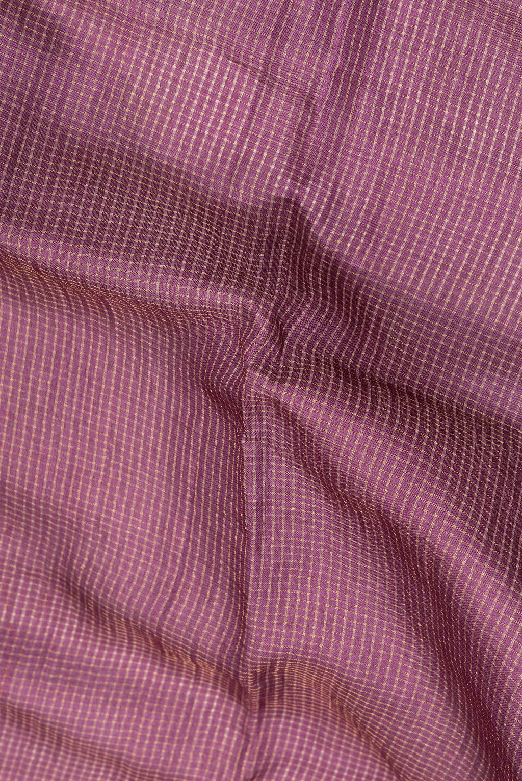 Close up of Pure Silk Burgundy Dual Tone Tussar Saree with Checked design on the body and Embroidery Border.  displaying folds