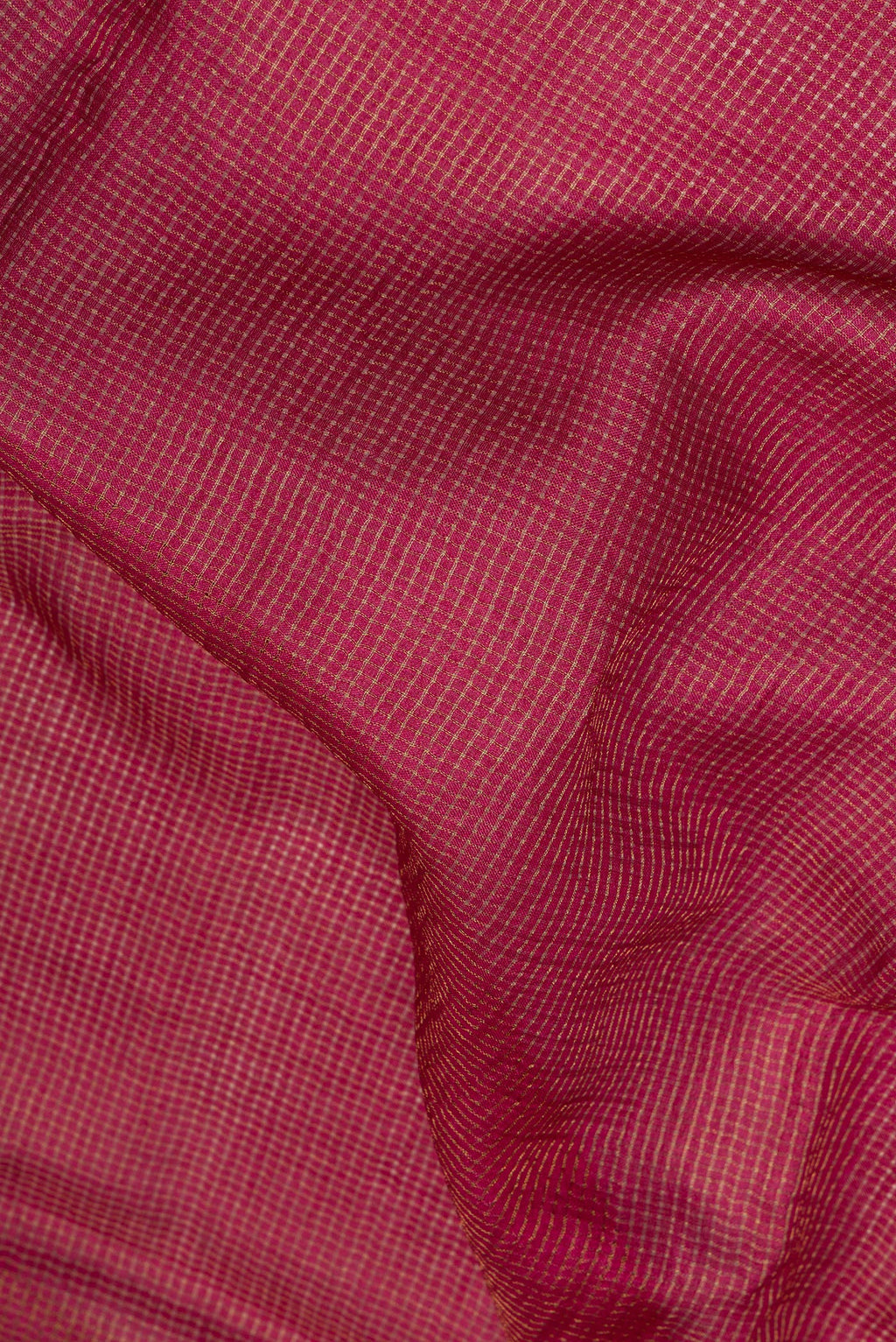 Close up of Maroon Dual Tone Tussar Saree with Checked design on the body and Embroidery Border.  displaying folds