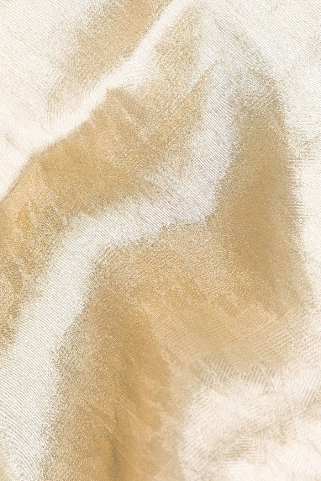 Close up of Gold Dual Tone Banarasi Tissue Saree with Zari Brocade on the body and Embroidery Border.  displaying folds
