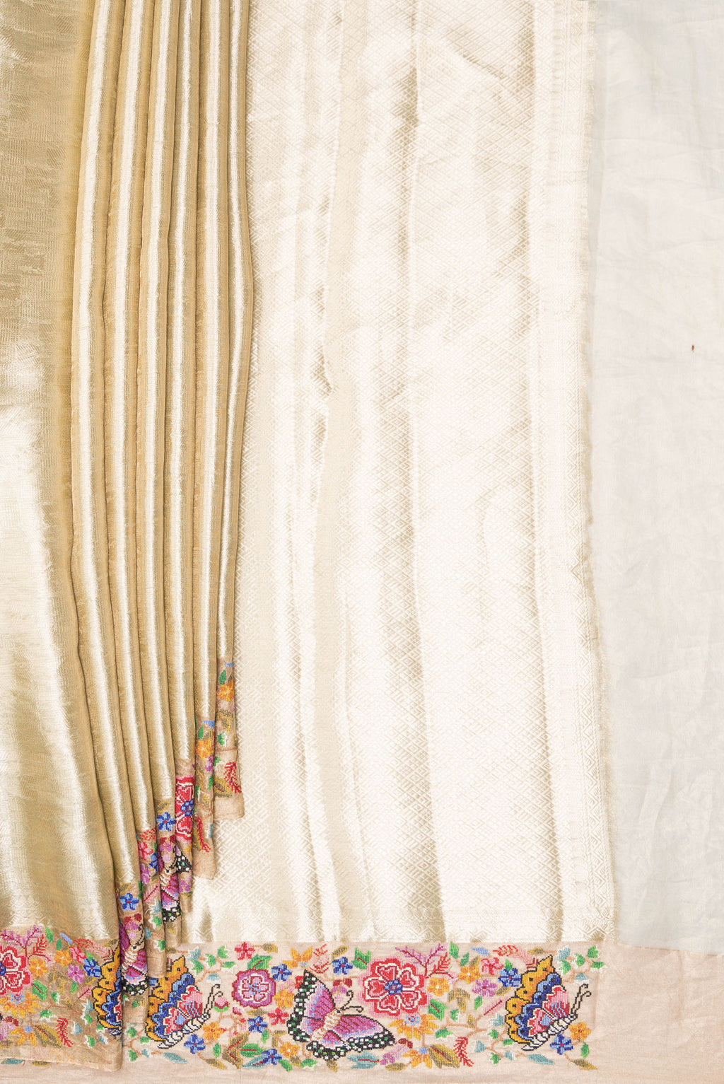 Pleats and pallu of Gold Dual Tone Banarasi Tissue Saree with Zari Brocade on the body and Embroidery Border. 