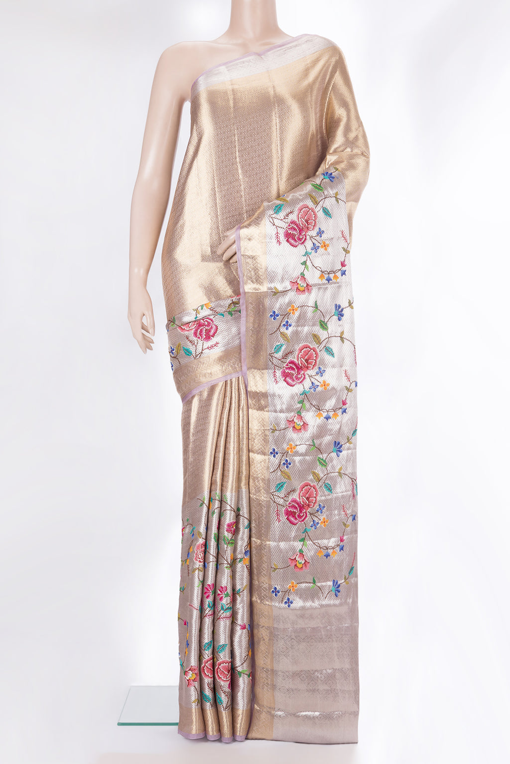 Gold and Lavender Color Banarasi Tissue Saree with Zari Brocade on the body and Embroidery Border.  displayed on a mannequin