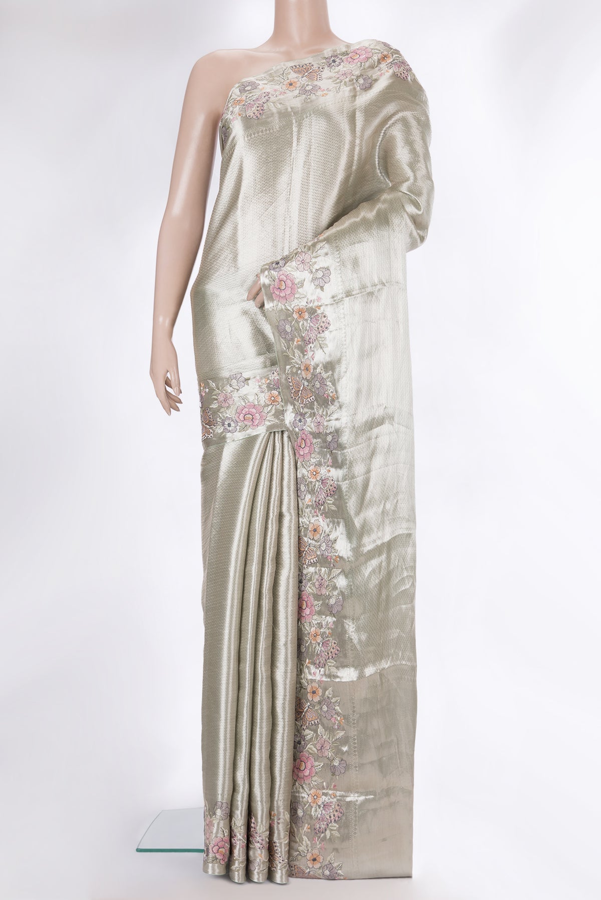 Pure Silk Silver Dual Tone Banarasi Saree with Zari Brocade on the body and Embroidery Border.  displayed on a mannequin