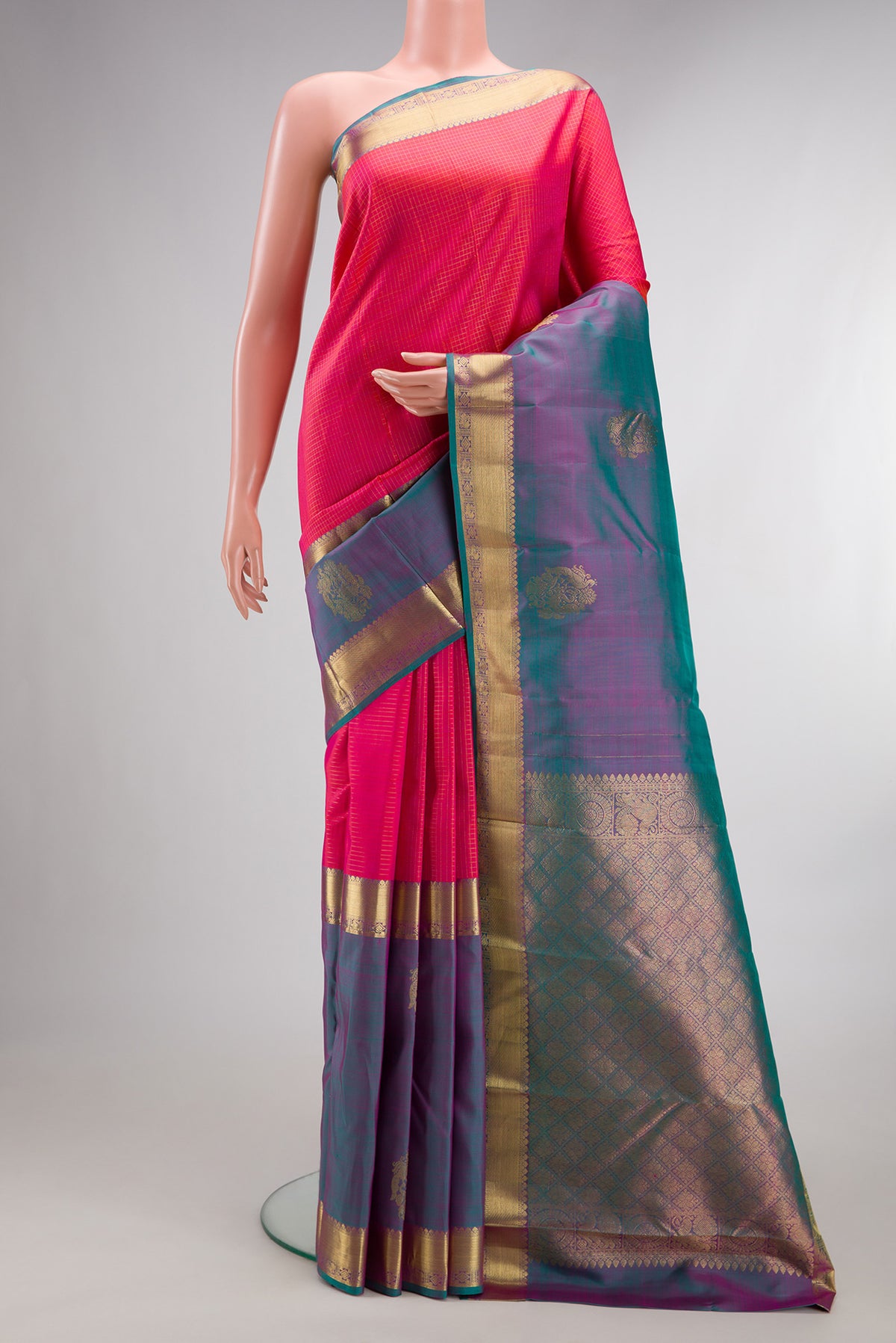 Pure Silk Pink Dual Tone Kanchipuram Saree with Checked design on the body and Zari Border.  displayed on a mannequin