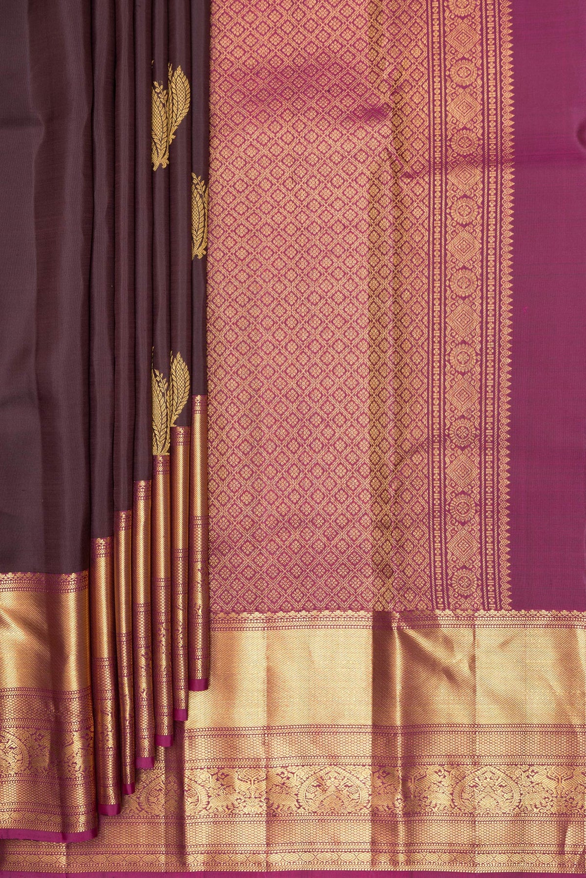 Pleats and pallu of Pure Silk Coffee Brown Kanchipuram Saree with Zari Butta on the body and Fancy Border. 