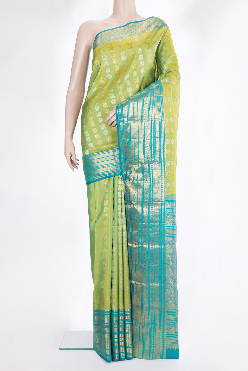 Pure Silk Green Dual Tone Kanjivaram Saree with Zari Butta on the body and Zari Border.  displayed on a mannequin