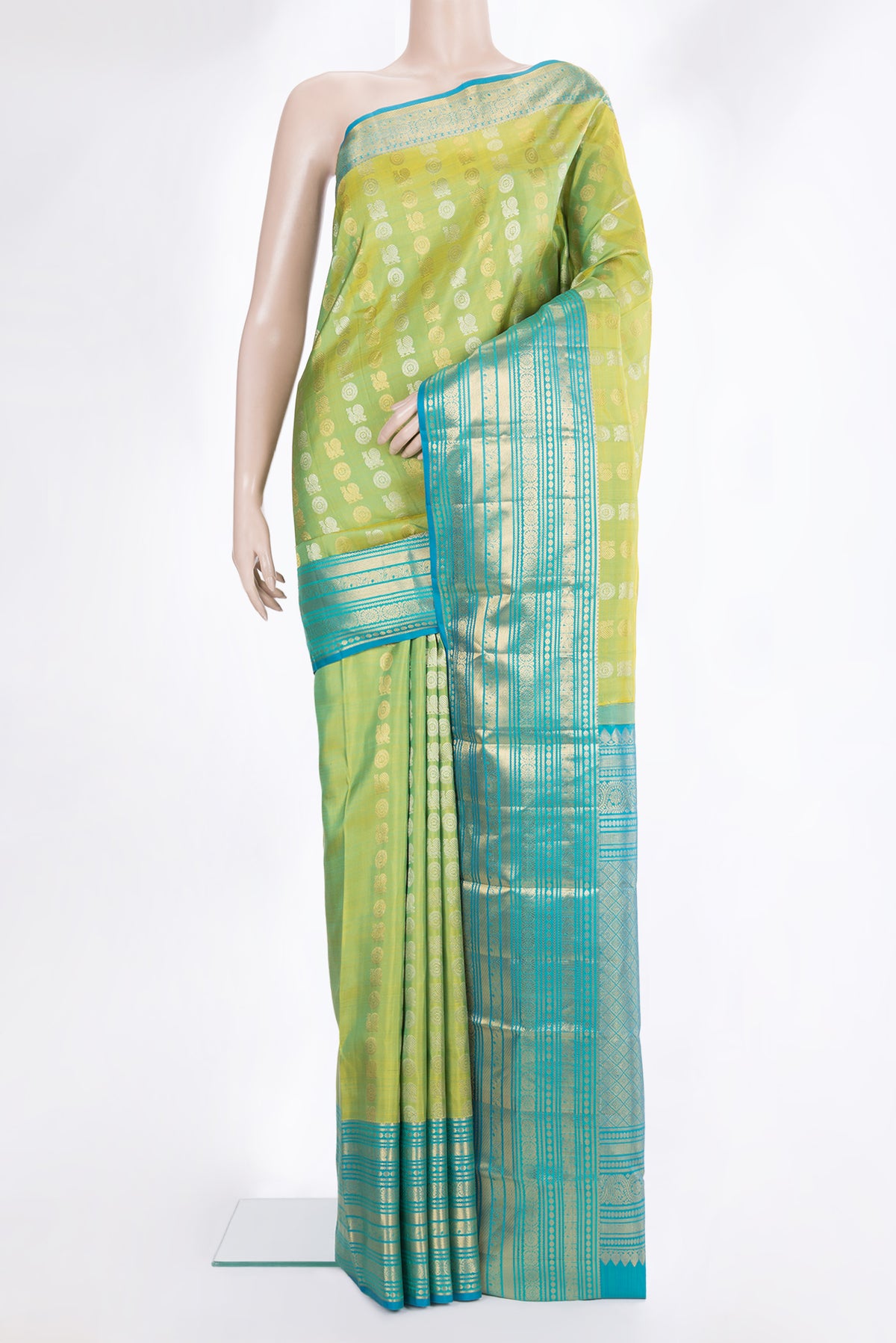 Pure Silk Green Dual Tone Kanjivaram Saree with Zari Butta on the body and Zari Border.  displayed on a mannequin
