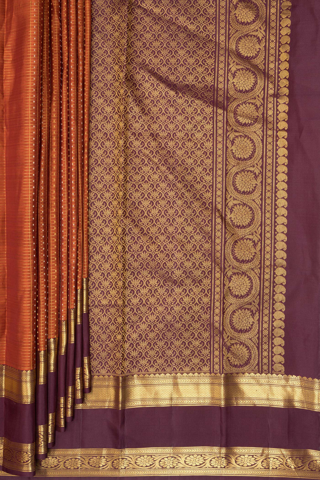 Pleats and pallu of Pure Silk Orange Kanjivaram Saree with Checked design on the body and Zari Border. 