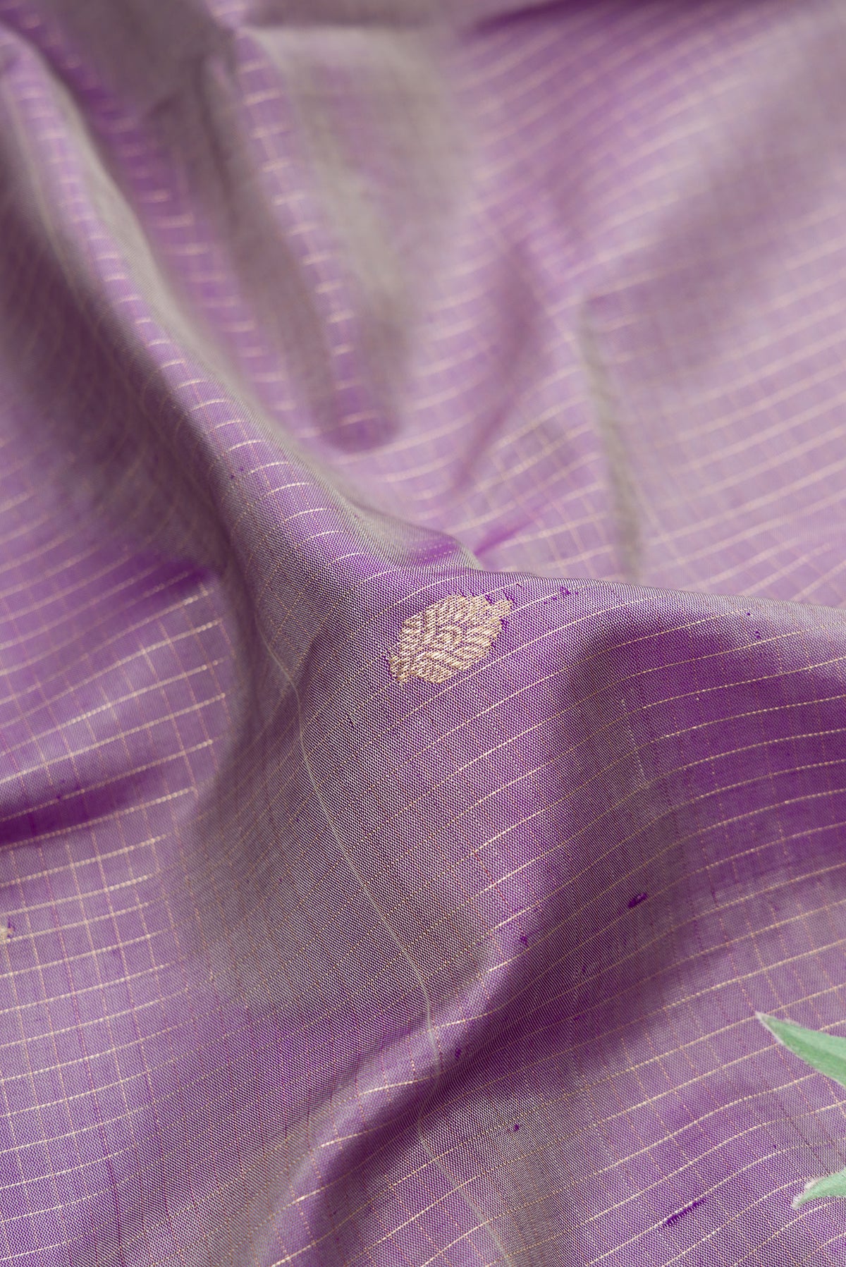 Close up of Pure Silk Purple Dual Tone Kanchipuram Saree with Checked design on the body and Fancy Border.  displaying folds