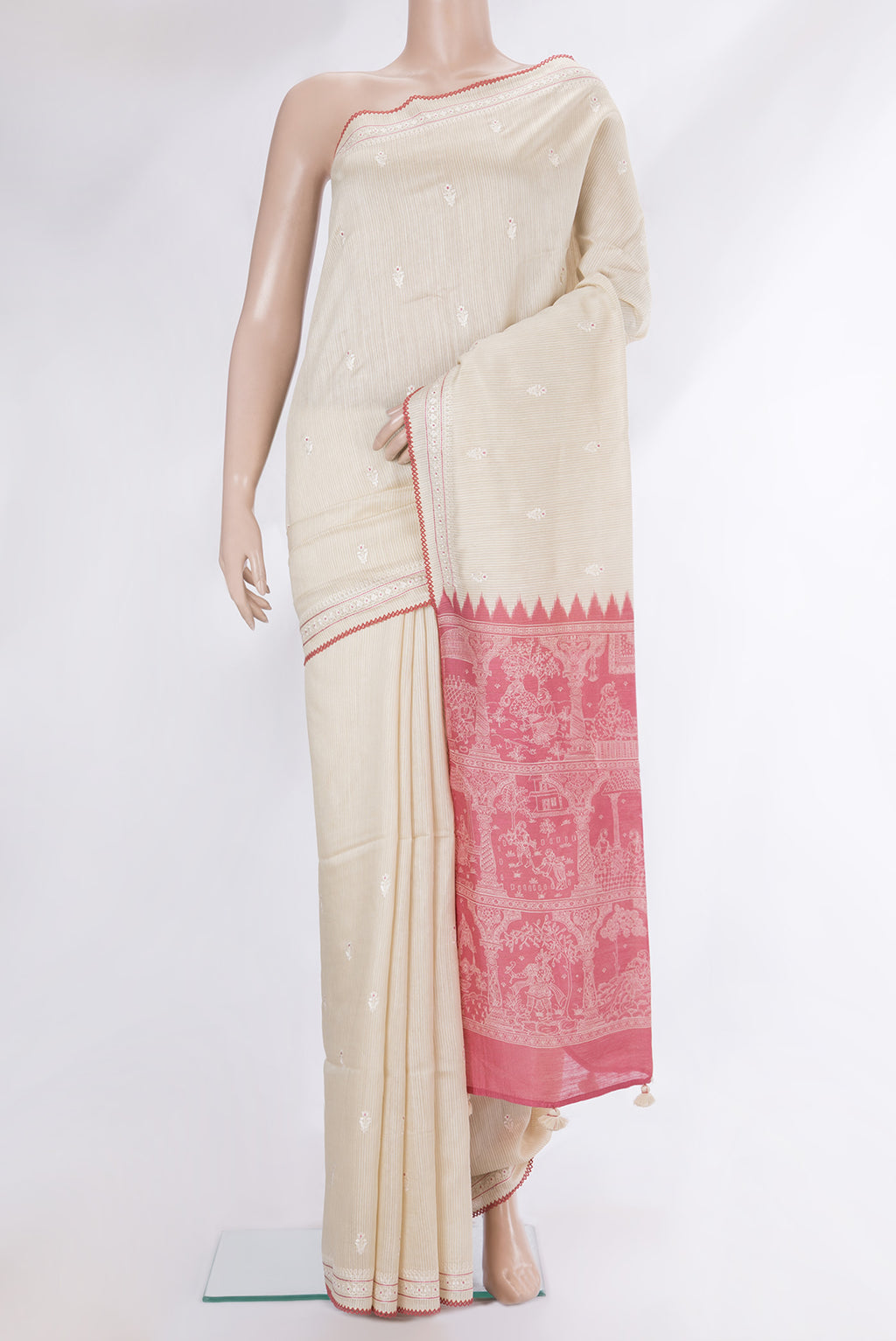 Cream Tussar Saree with Embroidery on the body and Embroidery Border.  displayed on a mannequin