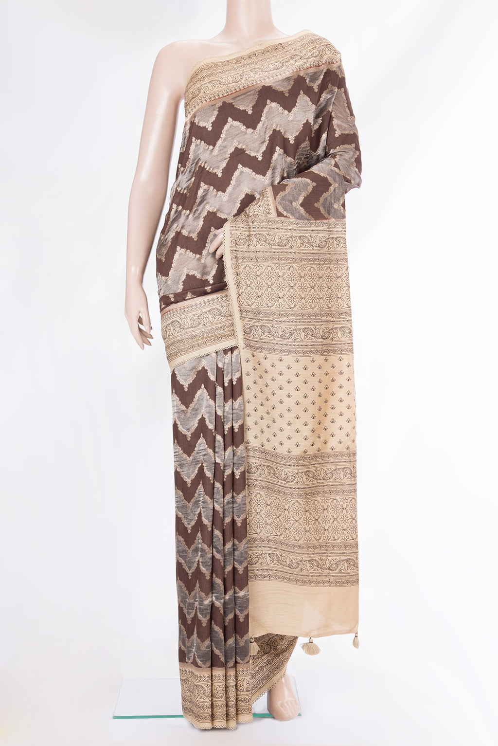 Brown Dual Tone Tussar Saree with Zari Brocade on the body and Embroidery Border.  displayed on a mannequin