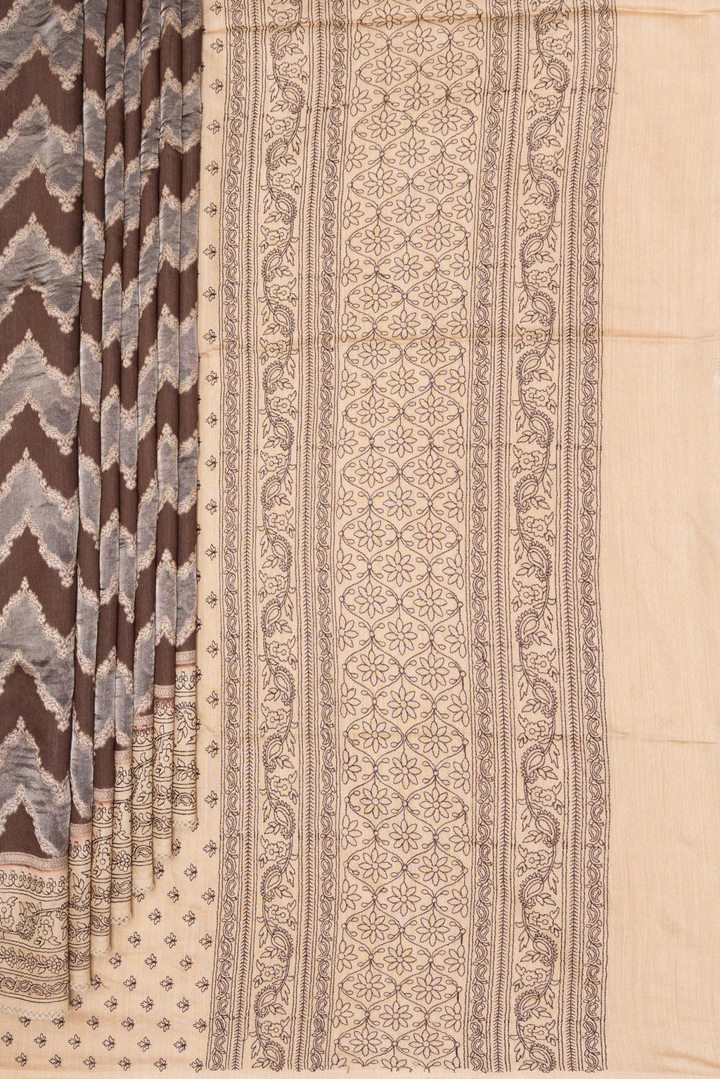 Pleats and pallu of Brown Dual Tone Tussar Saree with Zari Brocade on the body and Embroidery Border. 