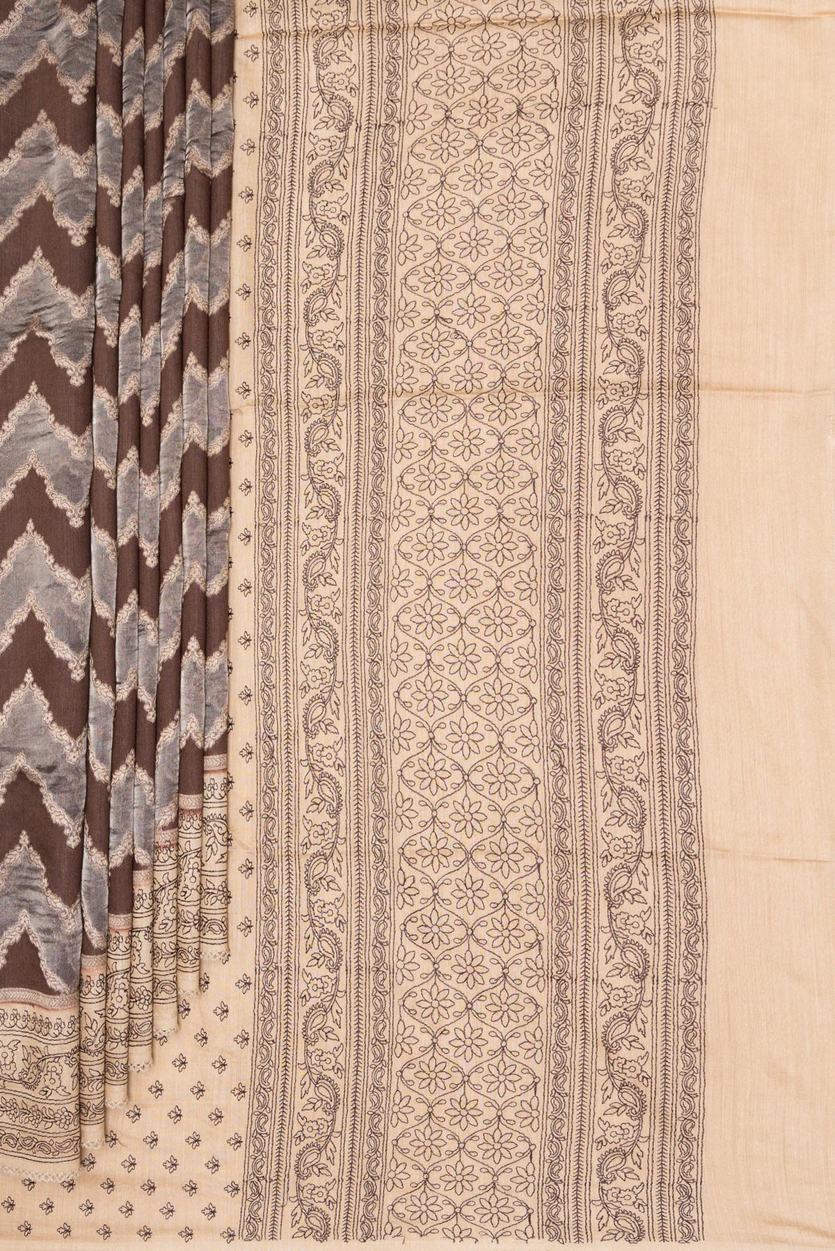 Pleats and pallu of Brown Dual Tone Tussar Saree with Zari Brocade on the body and Embroidery Border. 
