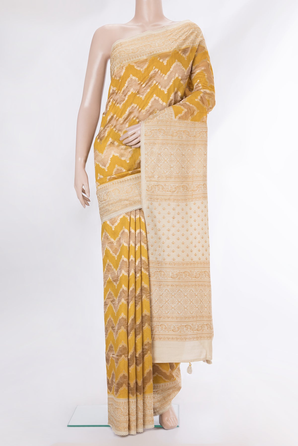 Pure Silk Mustard Dual Tone Tussar Saree with Zari Brocade on the body and Embroidery Border.  displayed on a mannequin