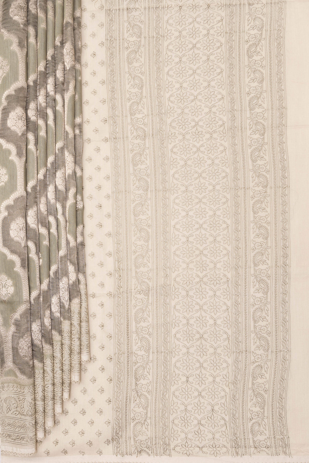Pleats and pallu of Pure Silk Grey Dual Tone Tussar Saree with Zari Brocade on the body and Embroidery Border. 