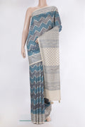Light Blue Dual Tone Tussar Saree with Zari Brocade on the body and Embroidery Border.  displayed on a mannequin