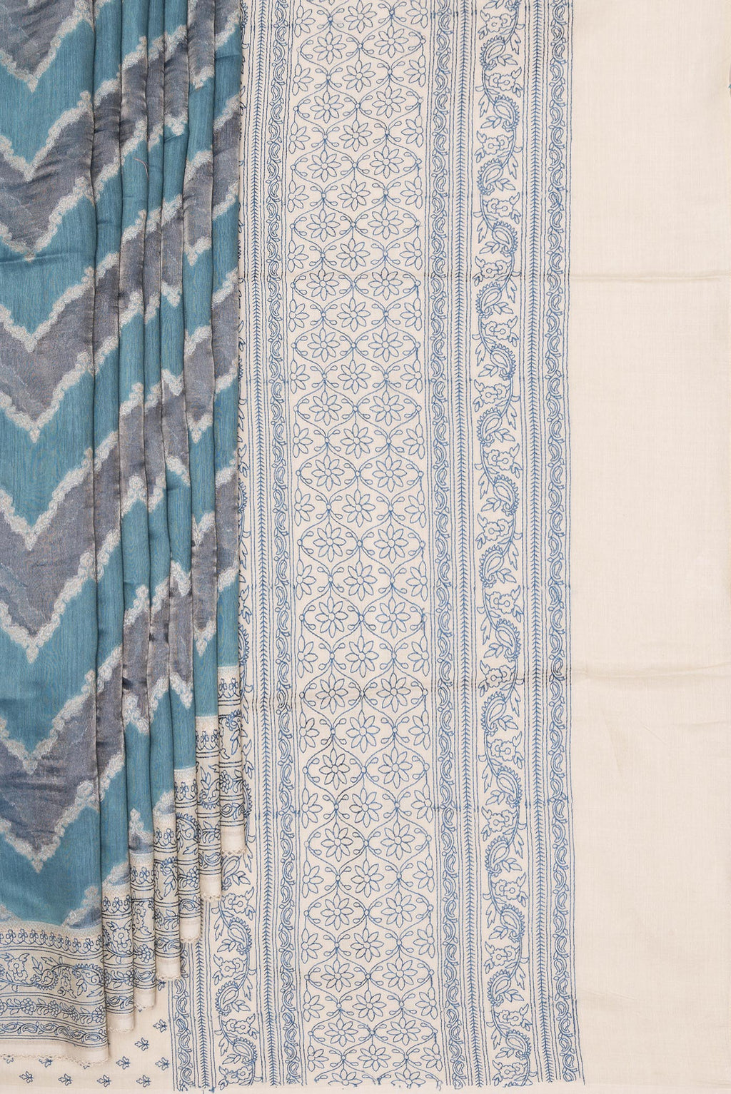 Pleats and pallu of Light Blue Dual Tone Tussar Saree with Zari Brocade on the body and Embroidery Border. 