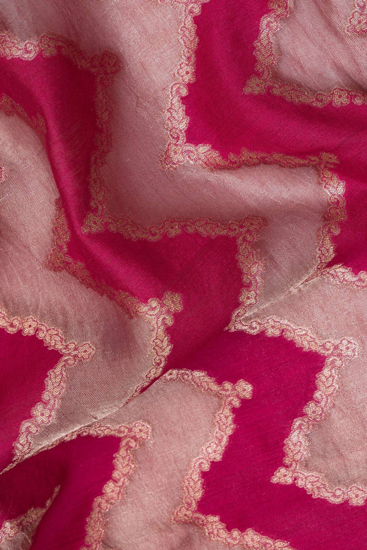 Close up of Pure Silk Dark Pink Dual Tone Tussar Saree with Zari Brocade on the body and Embroidery Border.  displaying folds