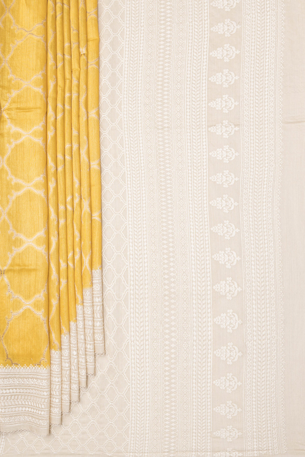 Pleats and pallu of Pure Silk Yellow Dual Tone Tussar Saree with Zari Brocade on the body and Embroidery Border. 
