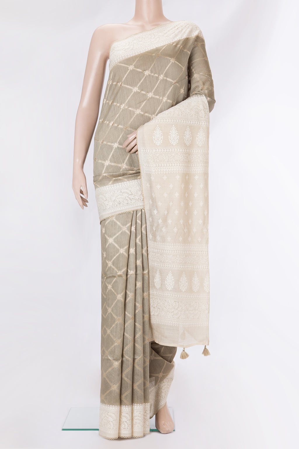 Pure Silk Grey Dual Tone Tussar Saree with Zari Brocade on the body and Embroidery Border.  displayed on a mannequin