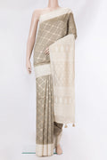 Pure Silk Grey Dual Tone Tussar Saree with Zari Brocade on the body and Embroidery Border.  displayed on a mannequin