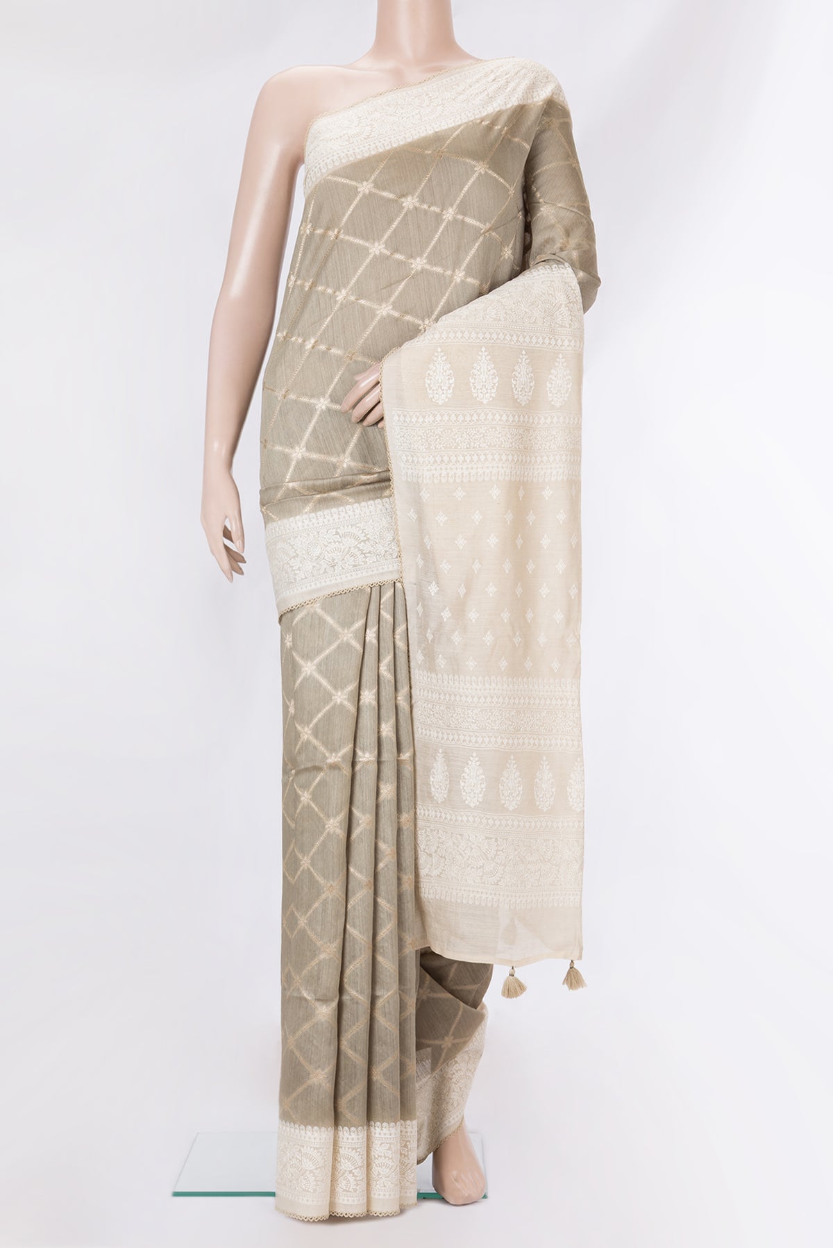 Pure Silk Grey Dual Tone Tussar Saree with Zari Brocade on the body and Embroidery Border.  displayed on a mannequin