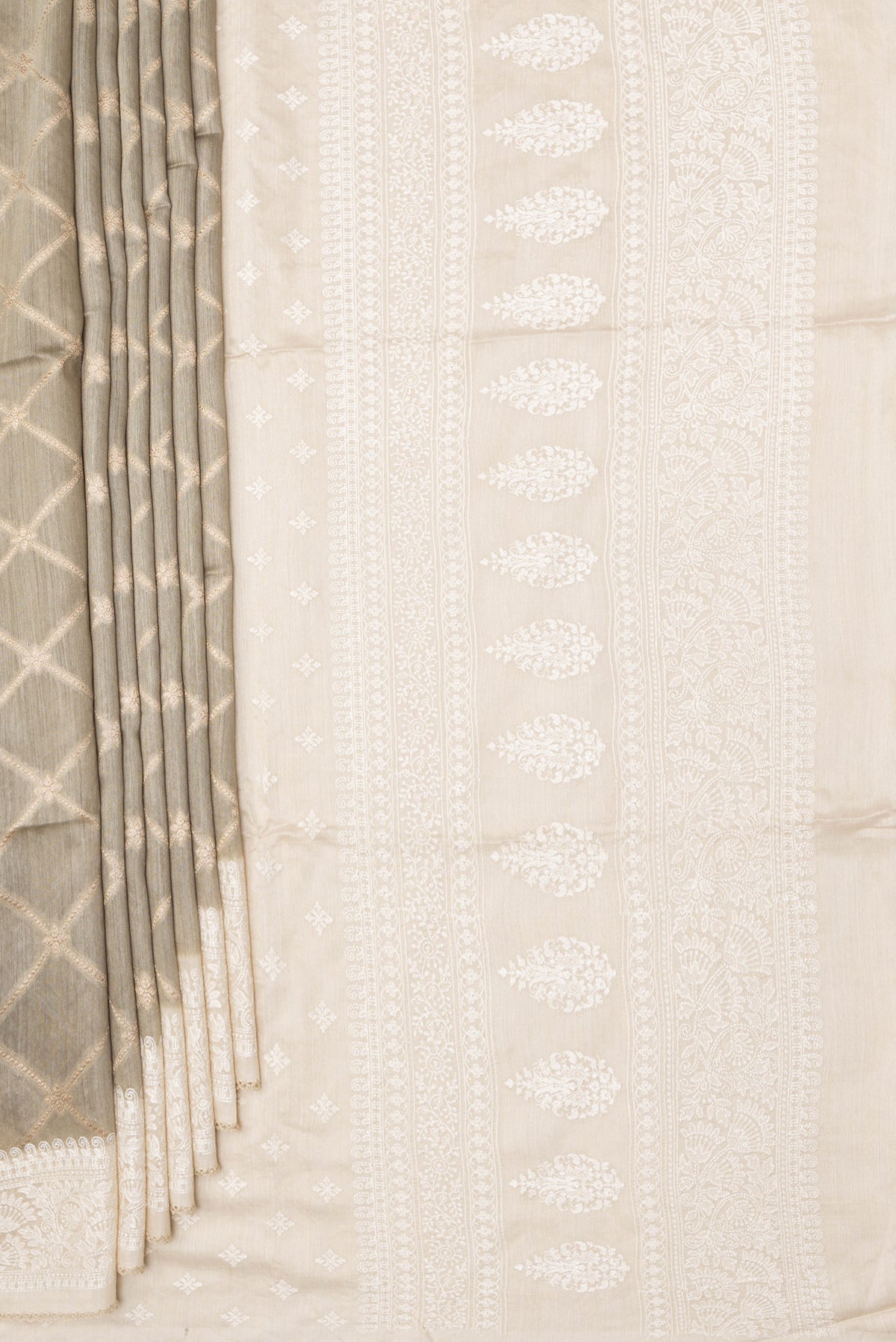 Pleats and pallu of Pure Silk Grey Dual Tone Tussar Saree with Zari Brocade on the body and Embroidery Border. 