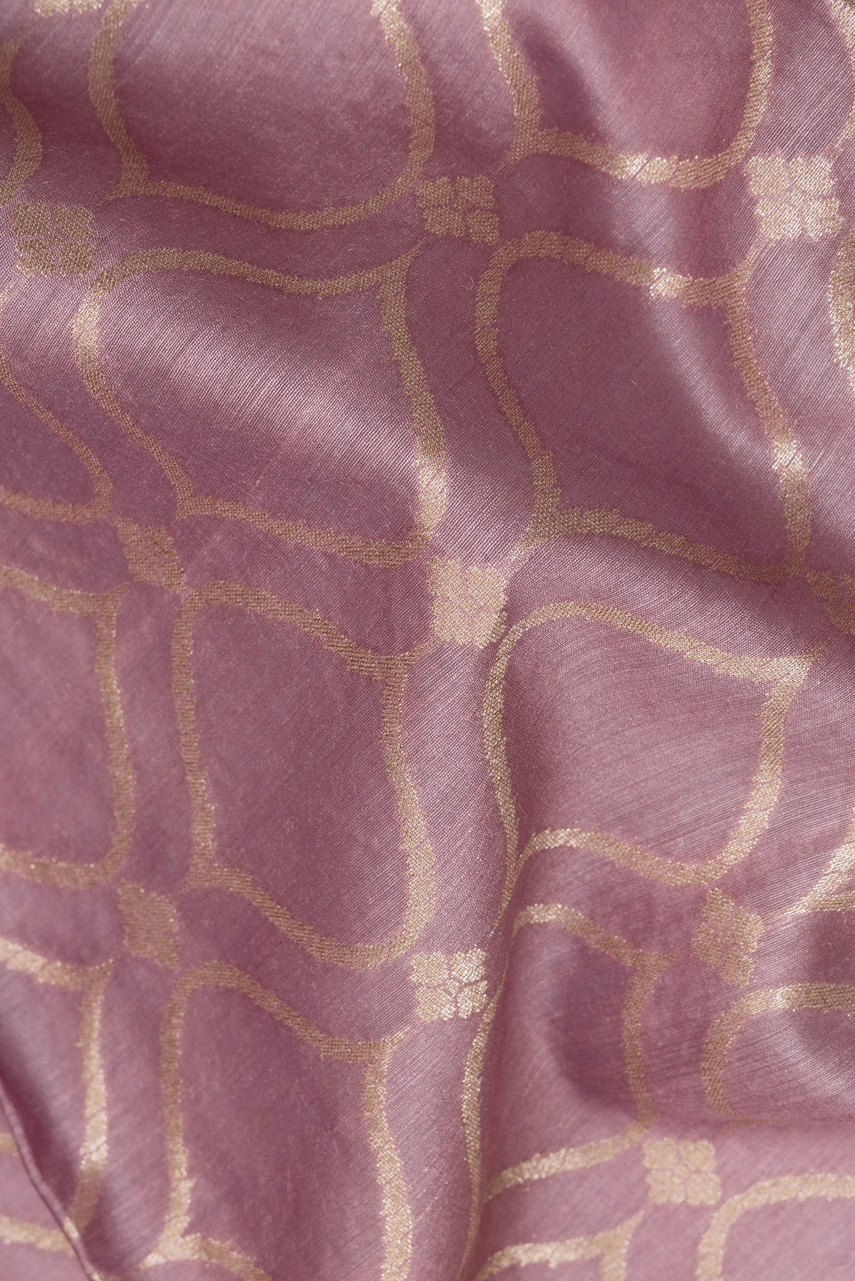 Close up of Pure Silk Lavender Dual Tone Tussar Saree with Zari Brocade on the body and Embroidery Border.  displaying folds