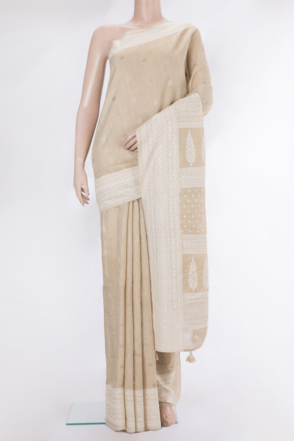 Pure Silk Beige Tussar Saree with Thread Butta on the body and Embroidery Border.  displayed on a mannequin