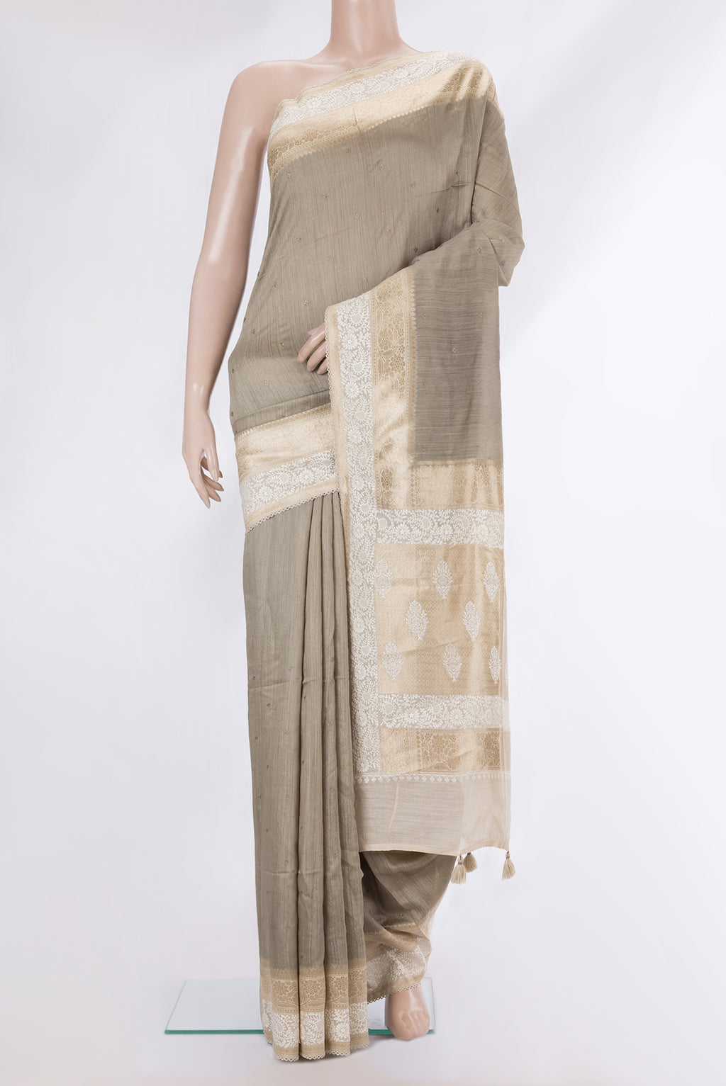 Pure Silk Dark Beige Tussar Saree with Embroidery on the body and Embroidery Border.  displayed on a mannequin