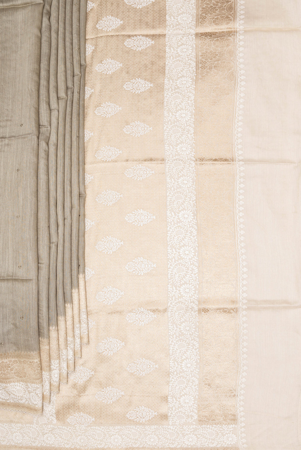 Pleats and pallu of Pure Silk Dark Beige Tussar Saree with Embroidery on the body and Embroidery Border. 
